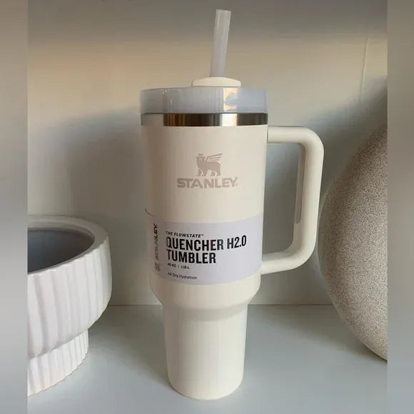 Stanley 40oz stainless steel tumbler with handle and straw – leakproof, vacuum insulated travel mug for hot and cold drinks available at Trendz Inn Pakistan.