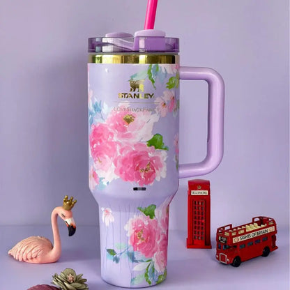 Stanley LoveShackFancy lavender rose bloom floral quencher tumbler with handle and straw featuring soft purple roses and gold trim by Trendz Inn