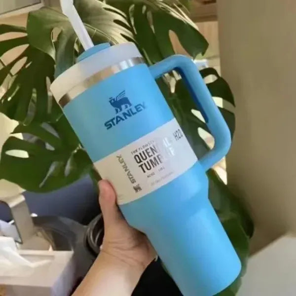 Stanley 40oz stainless steel tumbler with handle and straw – leakproof, vacuum insulated travel mug for hot and cold drinks available at Trendz Inn Pakistan.