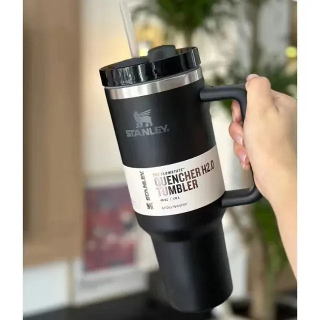 Stanley 40oz stainless steel tumbler with handle and straw – leakproof, vacuum insulated travel mug for hot and cold drinks available at Trendz Inn Pakistan.